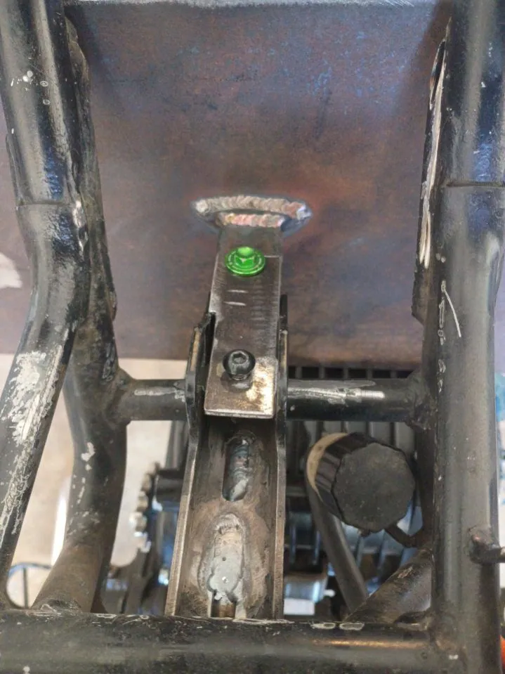Bracket welded to the battery box plate inside an electric dirt bike frame